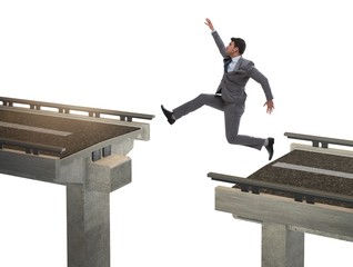 Young businessman with broken bridge isolated on white