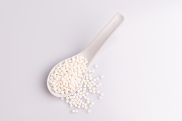 Tapioca pearls or sagu seeds, isolated on white background, soft light, studio photo