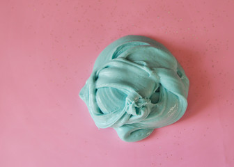 Hand made slime on pink background.