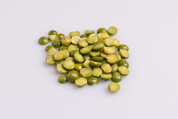 Split dried uncooked peas isolated on white background, close-up, studio shot, soft light, copy space. Christmas dish