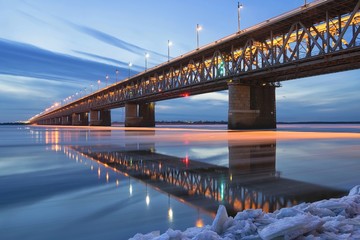 Ice drifting on the Amur river. Amur bridge. Trans siberian railway. Khabarovsk, far East, Russia.	