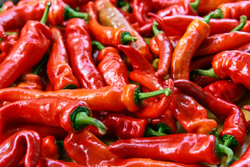 Red hot chilli peppers pattern texture background. Close up. Landscape. A backdrop ofRed hot chilli peppers. Street vegetable market. Group of Red hot chilli peppers