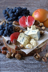 Cheese set with nuts and fruits. Keto diet. Keto snack. Keto Set Selective focus. Macro.