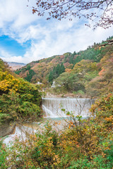 Waterfall at Tsuchiyu Onsen in beautiful autumn (fallen leaves) at tohoku, Fukushima, Japan
