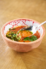 Gaspacho soup in bowl. Traditional spanish cold soup puree gaspacho or gazpacho on wooden table