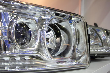 Car headlight device Close up, frontlight headlamp spare parts in shop
