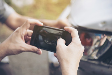 Insurance agent working during on site car accident claim process - people and car insurance claim...