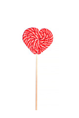 Red lollipop on a heart-shaped stick insulated on white