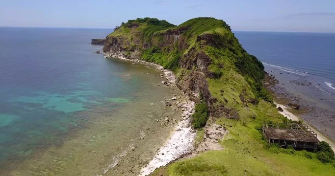 Tropical Philipino island capones on a sunny day by drone.