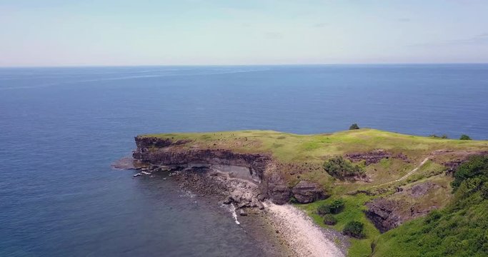 Tropical Philipino Island Capones on a sunny day by dron.