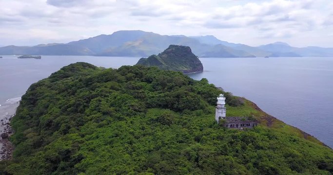 Tropical Philipino Island Capones on a sunny day by dron.