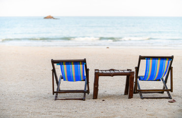 Two deck chair on the beach near sea,
