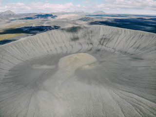 Aerial view of Hverfjall volcanic crater near Myvatn, Iceland in the summer with mountains in the...
