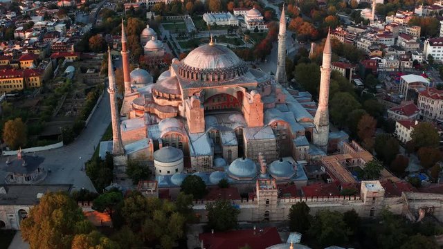 Dolly out aerial view of the Hagia Sophia Museum, Istanbul, Turkey, shot  at dawn with a drone
