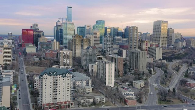 Aerial: Establishing shot of the Edmonton city skyline & apartment buildings at sunrise. Edmonton, Alberta, Canada. 21 April 2019