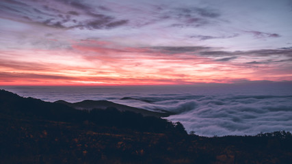 Sunrise over see of clouds