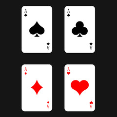  Playing cards. Four different suits located separately from each other on a dark background. Poker. Winning combination