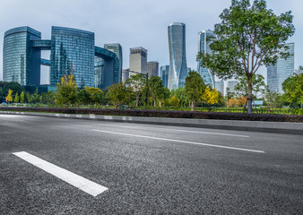 empty asphalt road front of modern buildings.