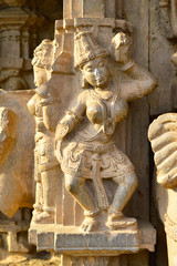 Fototapeta na wymiar Dancing female sculpture on the exterior wall of Kopeshwar Temple, Khidrapur, Maharashtra, India