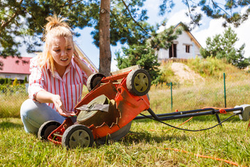 Person having problem with land mower