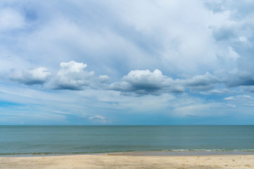 Fototapeta na wymiar Nobody on the beach with blue sky and clouds in rain season.