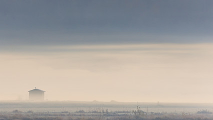 Outpost surrounded by fog on a early November morning