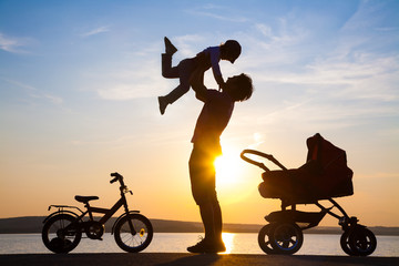 happy father with child  on sunset