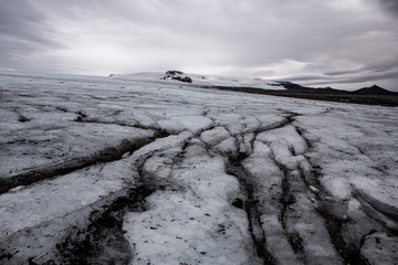 Snow covered mountain top of the Langjokull Glacier in the Golden Circle of Icleand. Majestic ice glacier with blue sky and clouds in Iceland. Beautiful narue. Winter landscape.