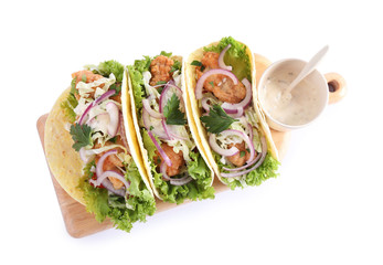 Yummy fish tacos with sauce isolated on white, top view