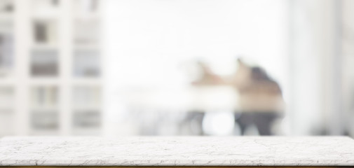 Close-up view of empty wooden table and copy space with blurred living room background