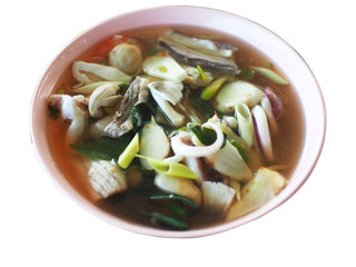 Tom Yum Seafood, spicy sour taste in pink cup on white background