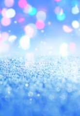 Winter abstract, blurred background with bokeh. Sparkling snow i