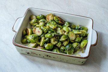 Homemade Roasted Brussel Sprouts in Porcelain Bowl.