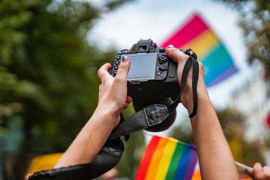 Correspondent takes photo during the Gay Pride parade