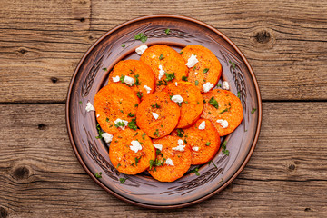 Roasted pumpkin with salted cheese and herbs
