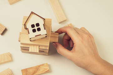 wooden house a woman's touch and a wooden tower on a white background