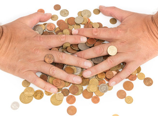 Hands over heap of coins.