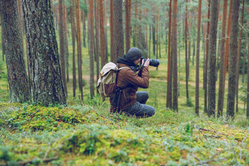 City Cesis, Latvia republic. The photographer is still photographing the forest landscape. 2. november 2019.