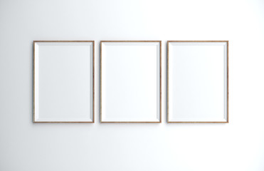 Three blank poster on wall.