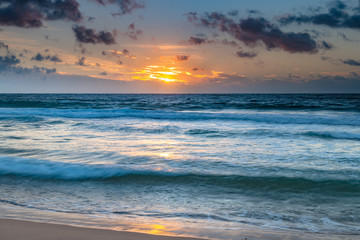 Fototapeta na wymiar Clouds, sea and surf sunrise seasape