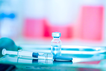 Vaccine vial dose flu shot drug needle syringe,medical concept vaccination hypodermic injection treatment disease care hospital prevention immunization illness disease baby background.