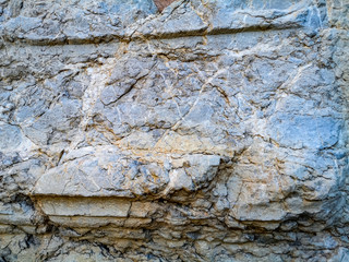Beautiful abstract pale yellow-blue stylized sandstone background. Rock texture with scuffs and...