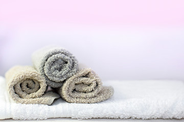 Stack of bath towels on background closeup