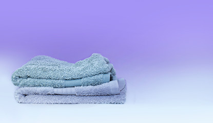 Stack of bath towels on background closeup