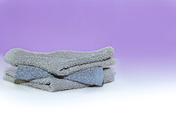 Stack of bath towels on background closeup