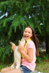 Portrait girl with dog. Jack Rassell with teen embracing