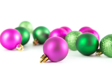 Group of green and lilac Christmas balls isolated on white background