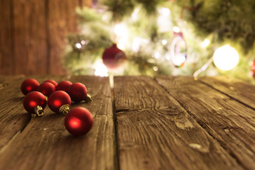 Goup of colorful Christmas baubles on wooden table. Christmas decorations on wooden surface