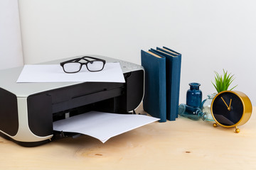 Office printer close up on a wooden table