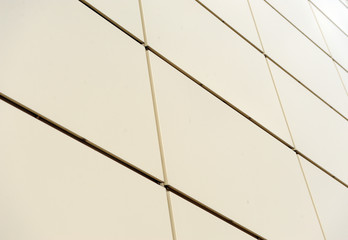 Detail shot of modern architecture facade.Texture of modern composite materials. Abstract background.The facade of the buildings is finished with a metal profile.